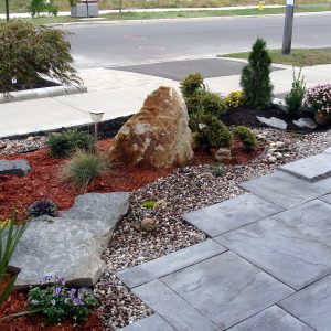 Landscaping project in front of the house, rock garden, travertine tiles, planting evergreens design